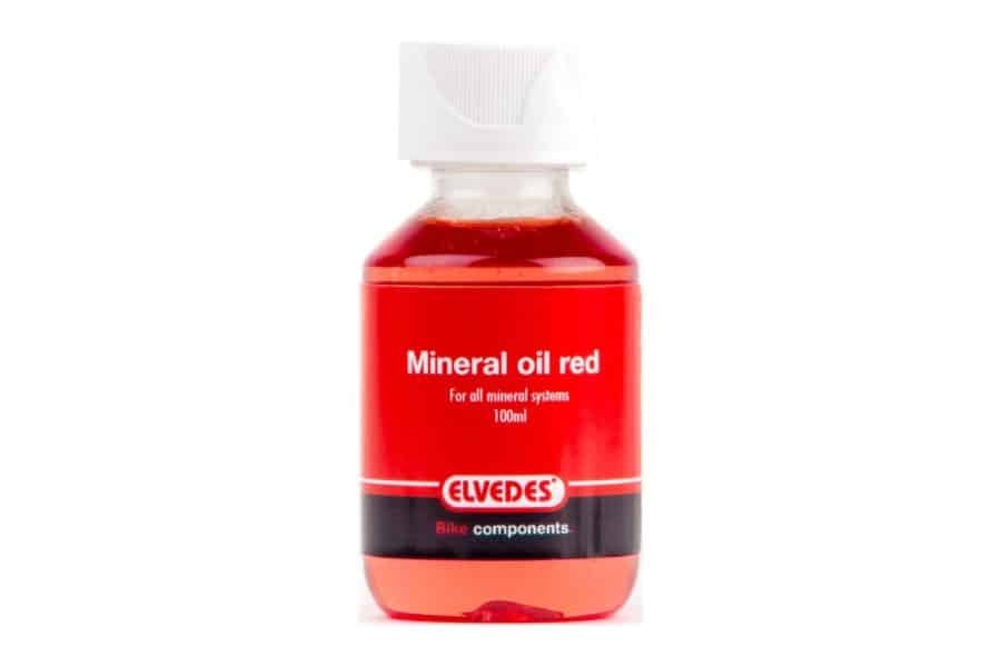 Huile minerale rouge en bouteille de 100 ml pour système de frein hydraulique vélo